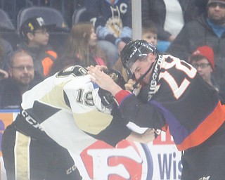 Phantoms defenseman Steve Ruggiero(28) and Lumberjacks forward Will Smith(19) battle it out during the 1st period as the Muskegon Lumberjacks take on the Youngstown Phantoms, Saturday, March 4, 2017 at the Covelli Centre. ..(Nikos Frazier | The Vindicator)..