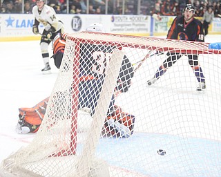 A puck flies into the net during the 1st period as the Muskegon Lumberjacks take on the Youngstown Phantoms, Saturday, March 4, 2017 at the Covelli Centre. ..(Nikos Frazier | The Vindicator)..