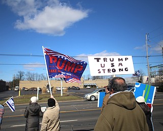 Supporters of President Donald Trump hold flags and signs at the Summitville Tile parking lot on 224, Saturday, March 4, 2017 in Boardman. ..(Nikos Frazier | The Vindicator)..