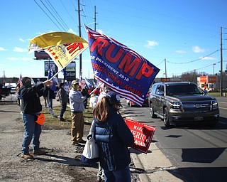 Supporters of President Donald Trump hold flags and signs at the Summitville Tile parking lot on 224, Saturday, March 4, 2017 in Boardman. ..(Nikos Frazier | The Vindicator)..