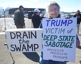 Michele Zolnier of Sharon holds two signs at the Summitville Tile parking lot on 224, Saturday, March 4, 2017 in Boardman. ..(Nikos Frazier | The Vindicator)..