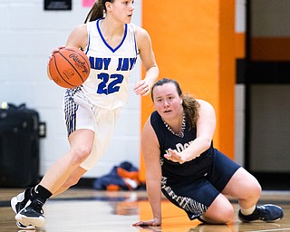 03-04-17 -Lady Basketball-  3rd. qtr., Jackson-Milton's #22 Michaelina Terranova dribbles away from McDonald's #30 Hannah Donkersl.  McDonald Devils vs Jackson-Milton Blue Jays at Mineral Ridge High School in Mineral Ridge, OH.