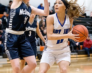 03-04-17 -Lady Basketball-  1st. qtr., Jackson-Milton's #11 Ashley Totani drives against McDonald's #11 Sam Stitt.  McDonald Devils vs Jackosn-Milton Blue Jays at Mineral Ridge High School in Mineral Ridge, OH.