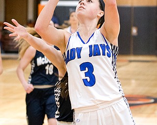 03-04-17 -Lady Basketball-  2nd. qtr., Jackson-Milton's #3 Emily Williams is fouled as she shoots against McDonald's #11 Sam Stitt.  McDonald Devils vs Jackson-Milton Blue Jays at Mineral Ridge High School in Mineral Ridge, OH.