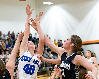 03-04-17 -Lady Basketball-  2nd. qtr., Jackson-Milton's #40 Abigal Spalding battles for the rebound against  McDonald's #12 Sam Homa and McDonald's #30 Hannah Donkers.  McDonald Devils vs Jackson-Milton Blue Jays at Mineral Ridge High School in Mineral Ridge, OH.