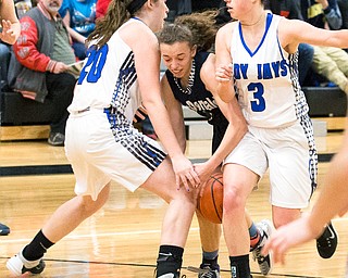 03-04-17 -Lady Basketball-  3rd. qtr., Jackson-Milton's #3 Emily Williams and Jackson-Milton's #20Ashley Cameron stop the drive of  McDonald's #3 Olivia Perry.  McDonald Devils vs Jackson-Milton Blue Jays at Mineral Ridge High School in Mineral Ridge, OH.