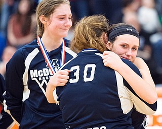 03-04-17 -Lady Basketball-   McDonald teammates console each other after losing the D4 district title game to Jackson-Milton. McDonald Devils vs Jackson-Milton Blue Jays at Mineral Ridge High School in Mineral Ridge, OH.