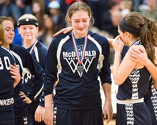 03-04-17 -Lady Basketball-   McDonald teammates console each other after losing the D4 district title game to Jackson-Milton. McDonald Devils vs Jackson-Milton Blue Jays at Mineral Ridge High School in Mineral Ridge, OH.