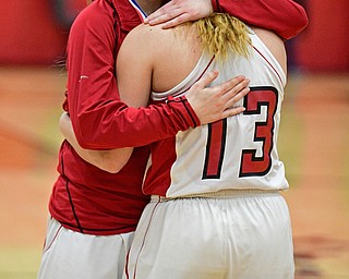STRUTHERS, OHIO - MARCH 4, 2017: Brittany Mook #22 of Columbiana hugs teammate Mariah Rovnak #13 of Columbiana after receiving her district runner up medal, Saturday afternoon at Struthers High School. DAVID DERMER | THE VINDICATOR