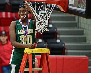 STRUTHERS, OHIO - MARCH 4, 2017: Anyah Curd #30 of Ursuline smiles while showing off a piece of net she cut during the celebration, Saturday afternoon at Struthers High School. DAVID DERMER | THE VINDICATOR