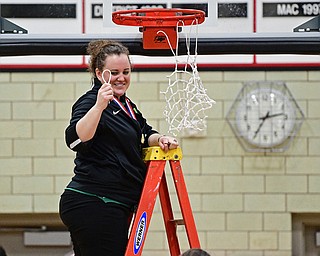 STRUTHERS, OHIO - MARCH 4, 2017: Head coach Vannessa Dickson smiles while showing off a piece of net she cut during the celebration, Saturday afternoon at Struthers High School. DAVID DERMER | THE VINDICATOR