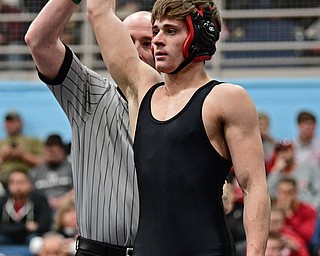 ALLIANCE, OHIO - MARCH 4, 2017: Dakota McCLOSKEY of Girard has his arm raised by the referee after winning his 3rd/4th place 120lb bout Saturday night at Alliance High School. DAVID DERMER | THE VINDICATOR