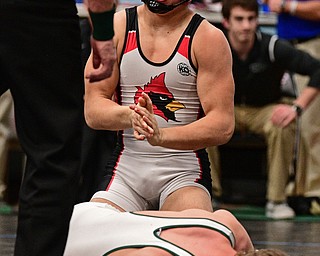 ALLIANCE, OHIO - MARCH 4, 2017: Anthony D'Alesio of Canfield celebrates after beating Colin Langer of Mentor Lake Catholic over onto his back during their 152lb 3rd/4th place bout Saturday night at Alliance High School. DAVID DERMER | THE VINDICATOR