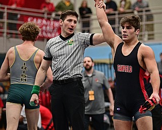 ALLIANCE, OHIO - MARCH 4, 2017: Georgio Poullas of Canfield has his arm raised by the referee after pinning Michael Mcintire of St. Vincent - St. Mary during their 160lb championship bout Saturday night at Alliance High School. DAVID DERMER | THE VINDICATOR
