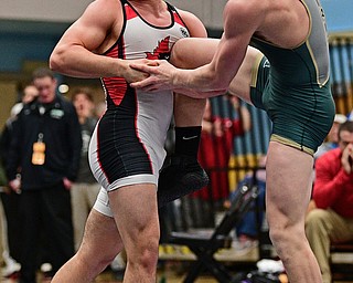 ALLIANCE, OHIO - MARCH 4, 2017: David Crawford of Canfield controls the leg of David Heath of St. Vincent-St. Mary while he has his face pressed against by Heath during their 170lb championship bout Saturday night at Alliance High School. DAVID DERMER | THE VINDICATOR