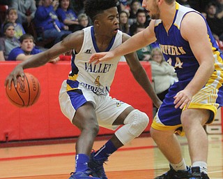William D Lewis the vindicator Valley's Jamynk Jackson(4) drives around Southerns Dakota Wetzel(14)..