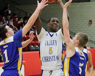 William D Lewis The Vindicator  Valley's Milan Square(5) shoots between Southern's Dominic Pugliano(1) and Jacob Joiner(5).