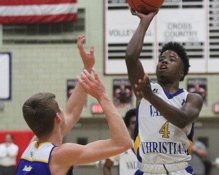 William D Lewis The vindicator Valley's Jamynk Jackson(4) shootas past Southern's Jacob Joiner(5).