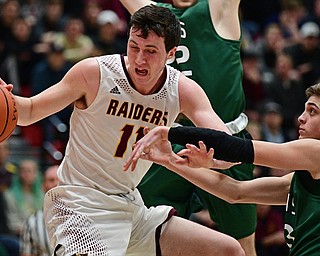 SALEM, OHIO - MARCH 7, 2017: Dan Ritter #11 of South Range loses control of the ball while spinning around William Jackson #13 of Canton Central Catholic during the first half of their game Tuesday night at Salem High School. DAVID DERMER | THE VINDICATOR