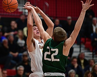 SALEM, OHIO - MARCH 7, 2017: Jaxon Anderson #23 of South Range has his shot blocked by Tommy Menches #22 of Canton Central Catholic during the first half of their game Tuesday night at Salem High School. DAVID DERMER | THE VINDICATOR