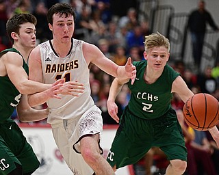 SALEM, OHIO - MARCH 7, 2017: Dan Ritter #11 of South Range has the ball poked out of his hand by Cameron Creamer #2 of Canton Central Catholic during the first half of their game Tuesday night at Salem High School. DAVID DERMER | THE VINDICATOR..Quinton Heck #5 of Canton Central Catholic pictured.