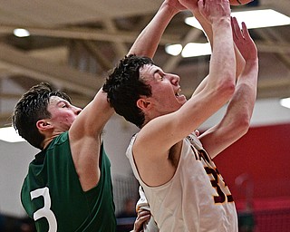 SALEM, OHIO - MARCH 7, 2017: Anthony Ritter #33 of South Range has the pass intended for him broken up by Brett Bossart #3 of Canton Central Catholic during the second half of their game Tuesday night at Salem High School. DAVID DERMER | THE VINDICATOR