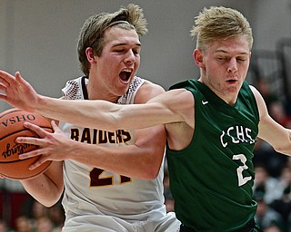 SALEM, OHIO - MARCH 7, 2017: Brandon Youngs #21 of South Range is cut off by Cameron Creamer #2 of Canton Central Catholic while driving to the basket during the second half of their game Tuesday night at Salem High School. DAVID DERMER | THE VINDICATOR