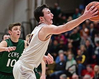 SALEM, OHIO - MARCH 7, 2017: Dan Ritter #11 of South Range reaches to corral in the deep pass while being trailed by Dylan Johnson #10 of Canton Central Catholic during the second half of their game Tuesday night at Salem High School. DAVID DERMER | THE VINDICATOR