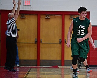 SALEM, OHIO - MARCH 7, 2017: Stone Sirpilla #33 of Canton Central Catholic celebrates after hitting a corner three point shot during the second half of their game Tuesday night at Salem High School. DAVID DERMER | THE VINDICATOR