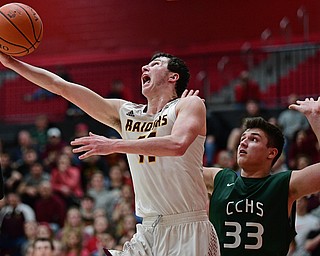 SALEM, OHIO - MARCH 7, 2017: Dan Ritter #11 of South Range goes to the basket around Stone Sirpilla #33 of Canton Central Catholic during the second half of their game Tuesday night at Salem High School. DAVID DERMER | THE VINDICATOR