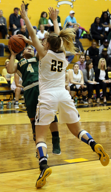 03-04-17 - D3 Regional Semi Girls Basketball-  Garfield G-Men vs Ursuline Irish at Cuyahoga Falls High School in Cuyahoga Falls, OH.  .1st.. qtr., Ursuline's #4 Nomiki Willis shoots against Garfield's #22 Makenna Lawrence