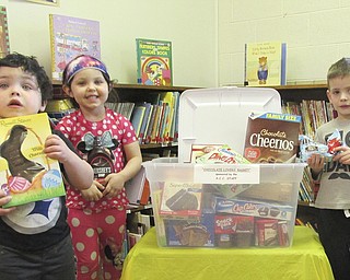 SPECIAL TO THE VINDICATOR
Austintown Community Church, 242 S. Canfield-Niles Road, will host its annual trash and treasure sale from 9 a.m. to 1 p.m. March 18 at its preschool childcare center. There also will be a basket raffle. From left, are Matthew Davila, Maria Davila and Ayden Ellashek, preschool students preparing a “Chocolate Lover’s” basket for the event. For information visit www.yourACC.org or call 330-793-1843.
