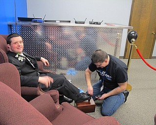Neighbors | Alexis Bartolomucci.One of the guests at the Night to Shine Prom at Highway Tabernacle on Feb. 10 got his shoes shined before the dance started.