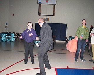 Neighbors | Alexis Bartolomucci.Guests danced with each other to the music during the Night to Shine Prom at Highway Tabernacle on Feb. 10.