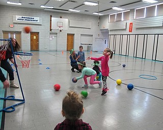 Neighbors | Alexis Bartolomucci.Students played basketball to see who could make a shop first during the Olympics at Poland North Preschool on Feb. 10.