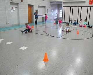 Neighbors | Alexis Bartolomucci.Students raced each other on scooters during the Poland North Preschool Olympics on Feb. 10.