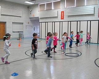 Neighbors | Alexis Bartolomucci.Students stood on one foot to see who could balance the longest during the Poland North Preschool Olympics on Feb. 10.