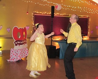 Neighbors | Alexis Bartolomucci.A father and daughter pair danced during the annual Father Daughter Dance at Boardman Park on Feb. 16.