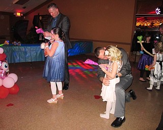 Neighbors | Alexis Bartolomucci.Fathers gave their daughters a rose during the rose ceremony at the annual Father Daughter Dance at Boardman Park on Feb. 16.
