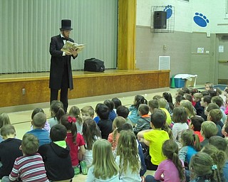 Neighbors | Alexis Bartolomucci.Actor Richard Waddingham dressed up as Abraham Lincoln and put on a presentation for the students at Poland Union on Feb. 15.