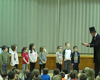 Neighbors | Alexis Bartolomucci.Students were selected to come up and help Abraham Lincoln during his presentation on Feb. 15 at Poland Union.