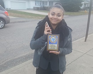 Neighbors | Submitted.Pictured is Chaney student Yelisa Cortez with her Speech and Debate State Qualifier plaque.
