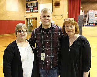 Neighbors | Abby Slanker.Canfield High School alumni Brian Chismar visited Canfield Village Middle School with The Great Lakes Theater Education Department, which performed “The Jabberwocky” on Feb. 24. Chismar is the sound designer for the theater and got his start in seventh-grade with the help of CVMS expressive arts teacher Kandace Cleland (right). His mother, Amy (left), also attended the production.