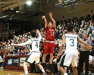 Austin O'Hara(33) goes up for three during the 1st quarter as Girard takes on Ursuline, Thursday, March 9, 2017 at Boardman High School. Ursuline won 62-53...(Nikos Frazier | The Vindicator)..