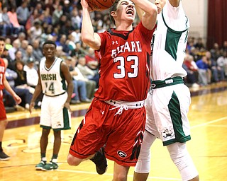 Austin O'Hara(33) of Girard pushes off Devin Keevy(23) of Ursuline during the 2nd quarter as Girard takes on Ursuline, Thursday, March 9, 2017 at Boardman High School. Ursuline won 62-53...(Nikos Frazier | The Vindicator)..