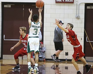 Anise Algahmere(3) of Ursuline goes up for three during the 2nd quarter as Girard takes on Ursuline, Thursday, March 9, 2017 at Boardman High School. Ursuline won 62-53...(Nikos Frazier | The Vindicator)..