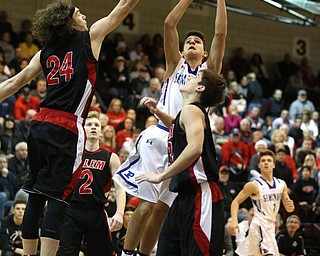 Poland sophomore guard Braeden O'Shaungnessy(3) goes up for a layup during the 1st half as Salem takes on Poland Seminary, Thursday, March 9, 2017 at Boardman High School. Salem won 70-66...(Nikos Frazier | The Vindicator)..