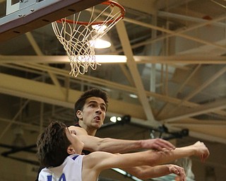 Daniel Kramer(10) of Poland's shot is deflected by Jon Gerace(5) of Salem during the 1st half as Salem takes on Poland Seminary, Thursday, March 9, 2017 at Boardman High School. Salem won 70-66...(Nikos Frazier | The Vindicator)..