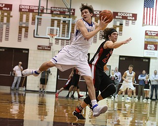 Daniel Kramer(10) of Poland intercepts a ass intended for Chase Ackerman(24) of Salem during the 1st half as Salem takes on Poland Seminary, Thursday, March 9, 2017 at Boardman High School. Salem won 70-66...(Nikos Frazier | The Vindicator)..