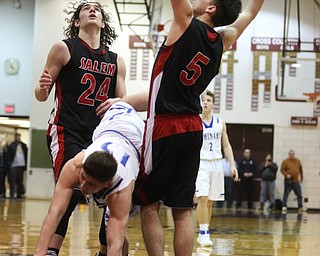 Stephen Bannon(15) of Poland collides with Jon Gerace(5) and Chase Ackerman(24) of Salem while going up for a layup during the 2nd half as Salem takes on Poland Seminary, Thursday, March 9, 2017 at Boardman High School. Salem won 70-66...(Nikos Frazier | The Vindicator)..